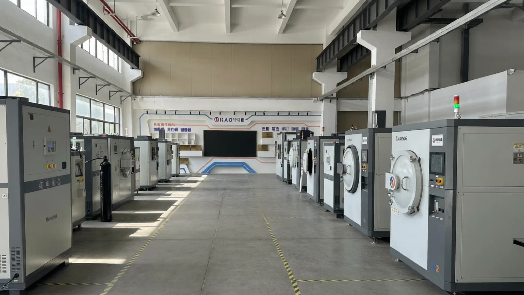 Huayue Laboratory process floor with laboratory furnaces arranged along a central aisle